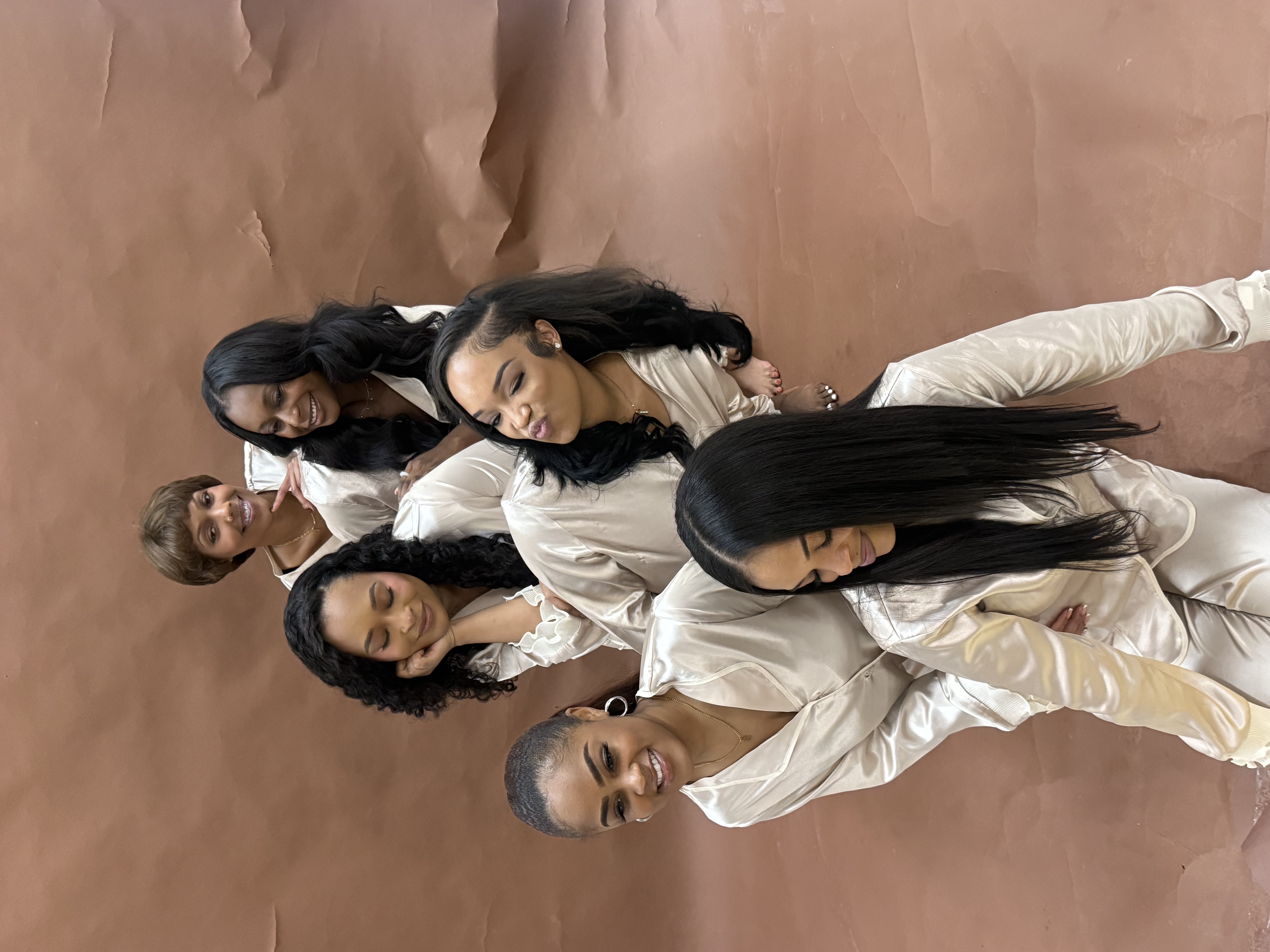 Group behind the scenes stacked pose